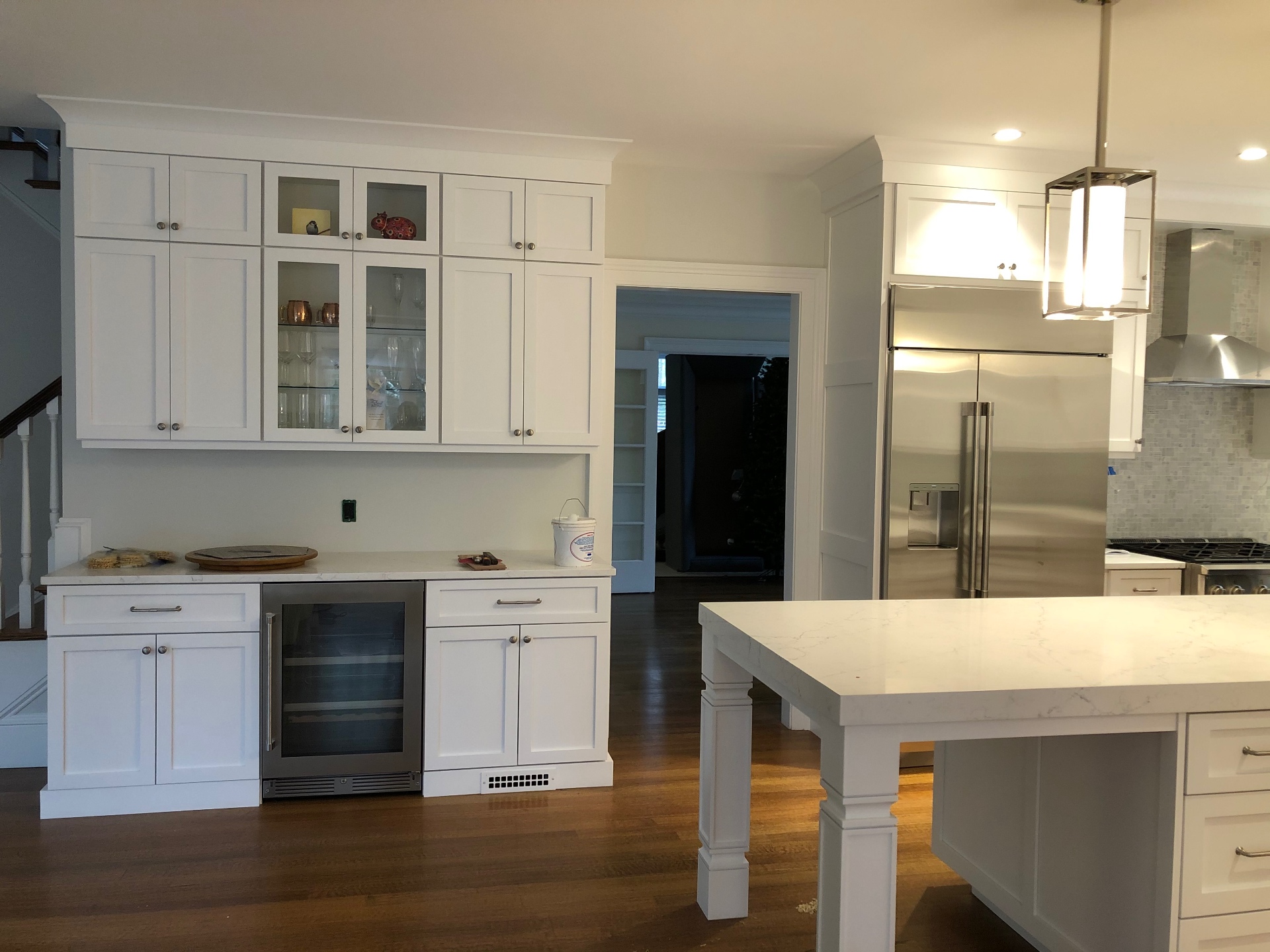 White kitchen with glass-front cabinets
